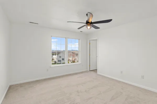a view of a glass door and an empty room