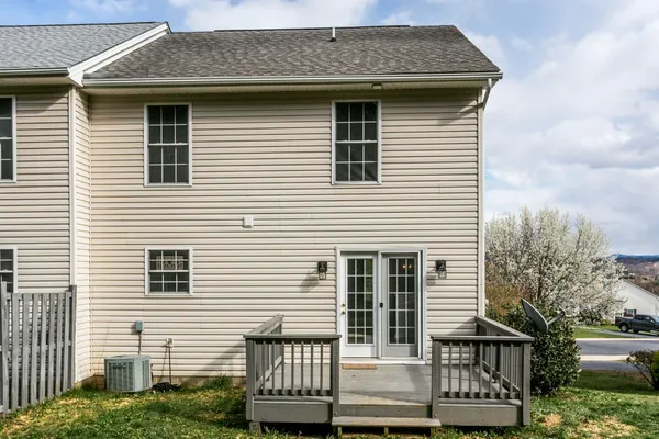 a view of a house with backyard and porch