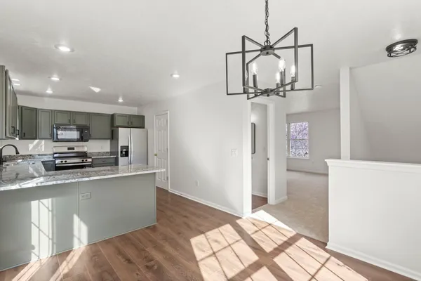 a view of an empty room with windows