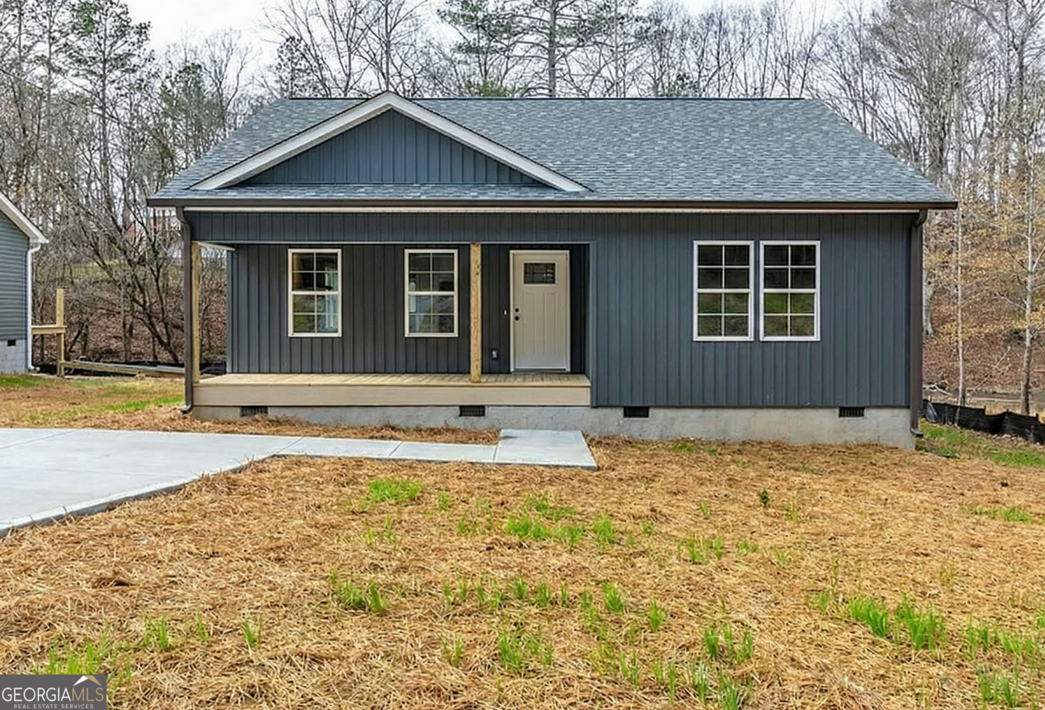 a house with trees in the background