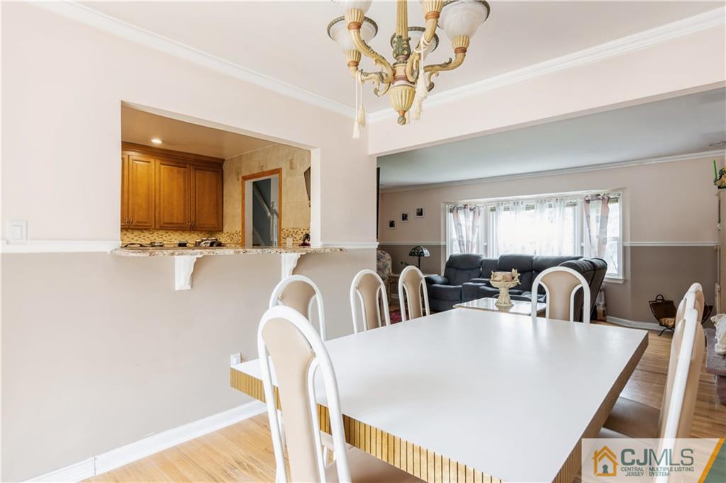 33 Dusko Drive Sayreville, NJ 08859 - Photo 12 of 30 a dining room with wooden floor and large windows
