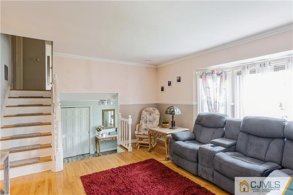 33 Dusko Drive Sayreville, NJ 08859 - Photo 15 of 30 a living room with furniture and a wooden floor