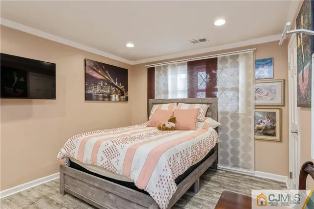 a bedroom with bed and a window