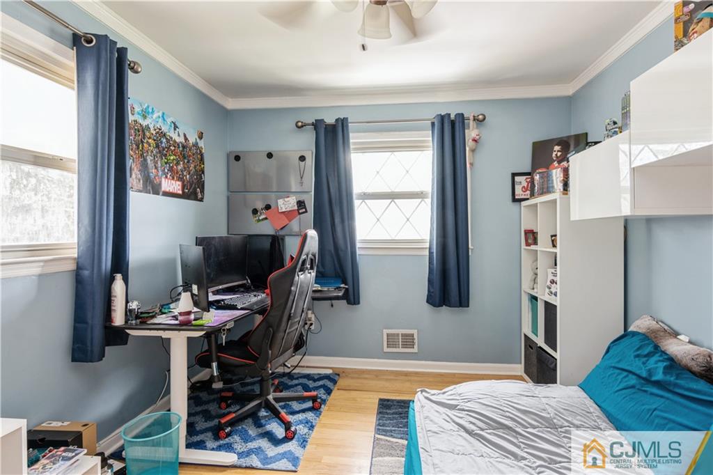 33 Dusko Drive Sayreville, NJ 08859 - Photo 18 of 30 a bedroom with a bed and a window