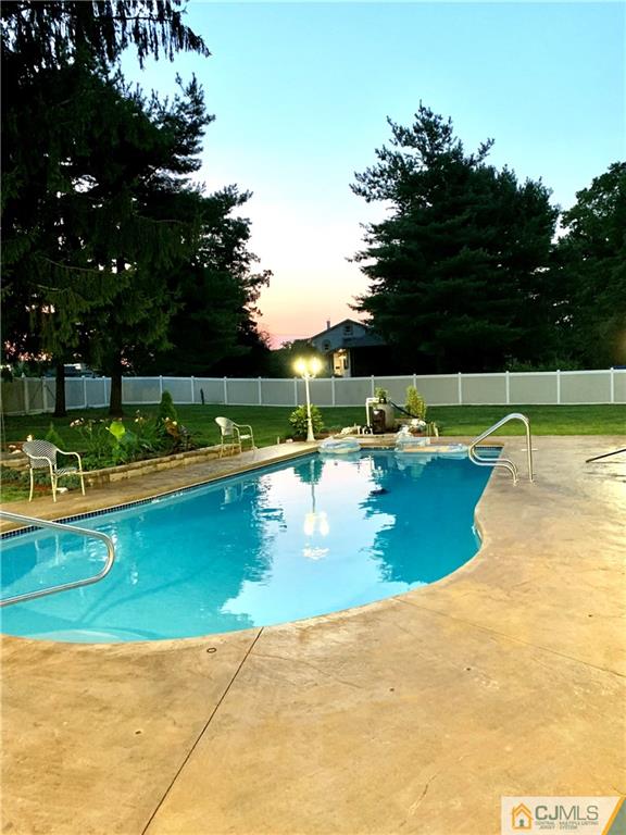 33 Dusko Drive Sayreville, NJ 08859 - Photo 25 of 30 a view of a swimming pool with a patio and a yard