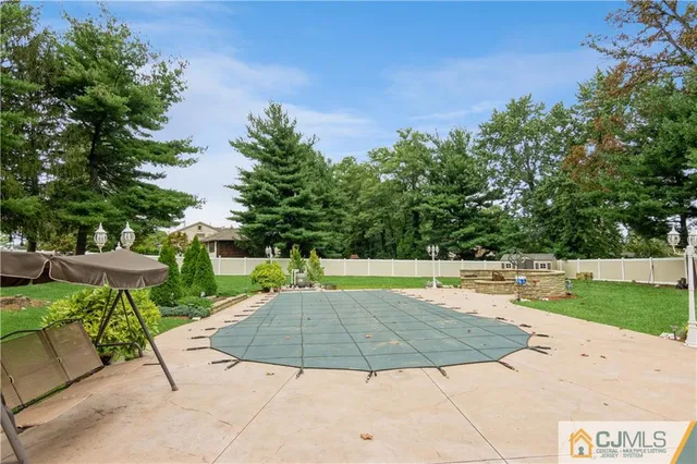 a view of a backyard with sitting area