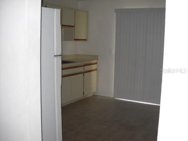 a room with a stove and a microwave