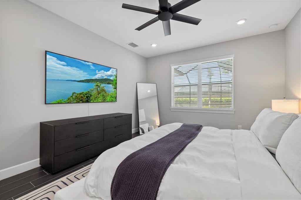 3508 Anchor Bay Trail Lakewood Ranch, FL 34211 - Photo 20 of 74 a bedroom with a bed and a flat screen tv