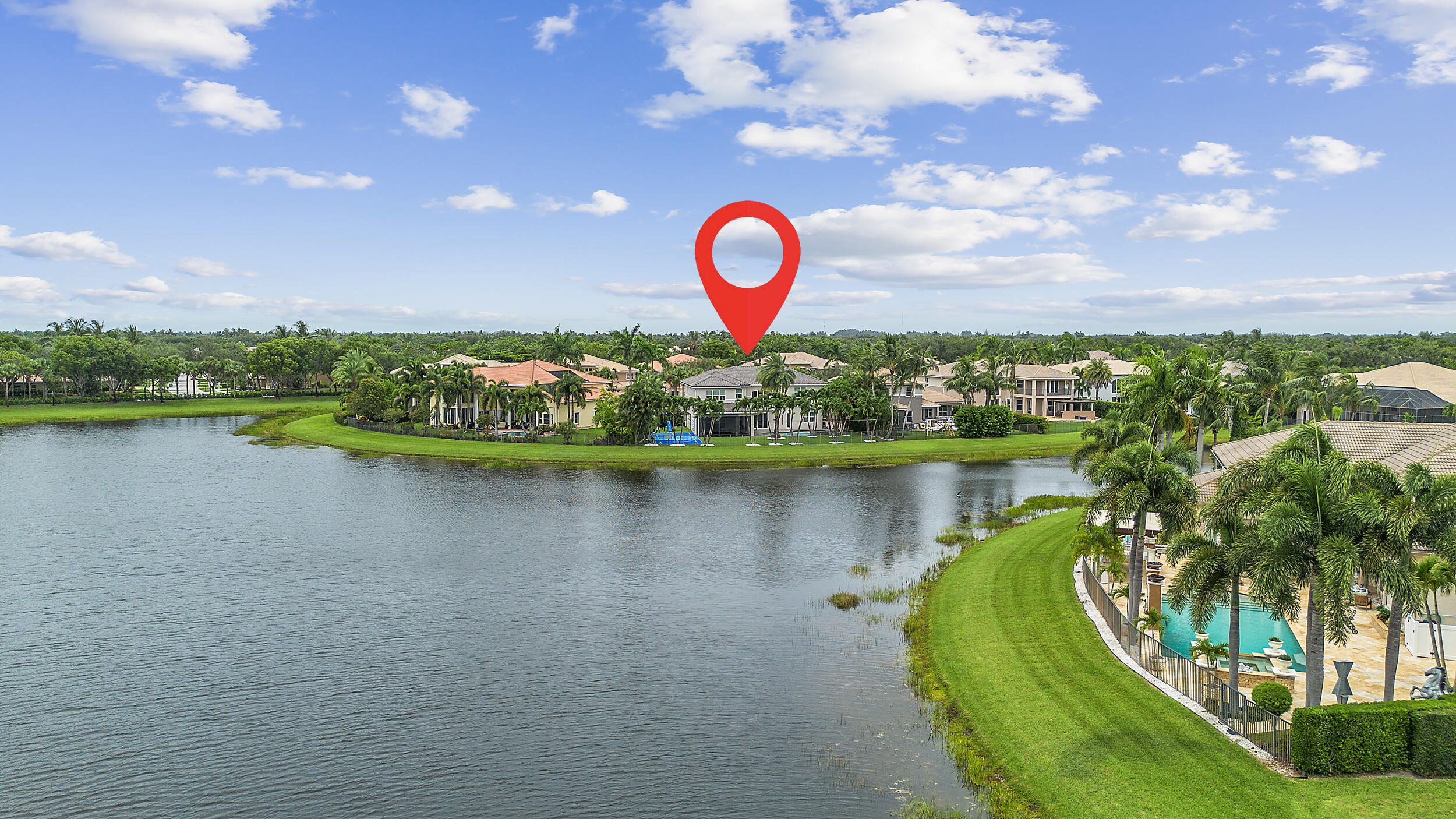 8680 Daystar Ridge Point Boynton Beach, FL 33473 - Photo 6 of 25 a view of a lake with a house in the background