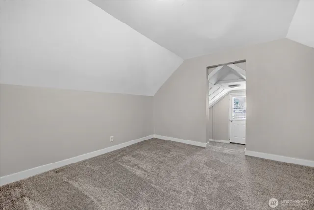 an empty room with a bathroom