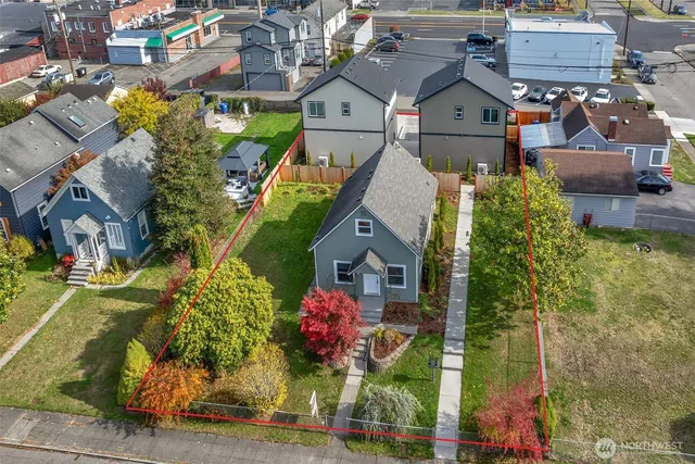 an aerial view of residential houses with outdoor space