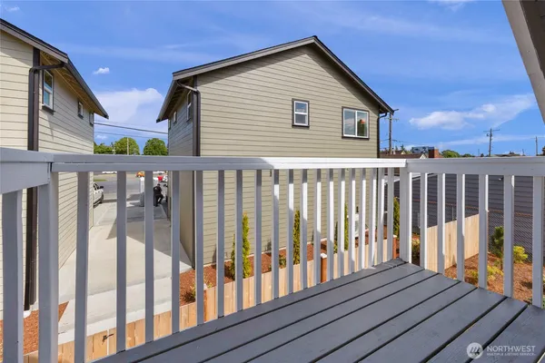 a view of a house with wooden deck