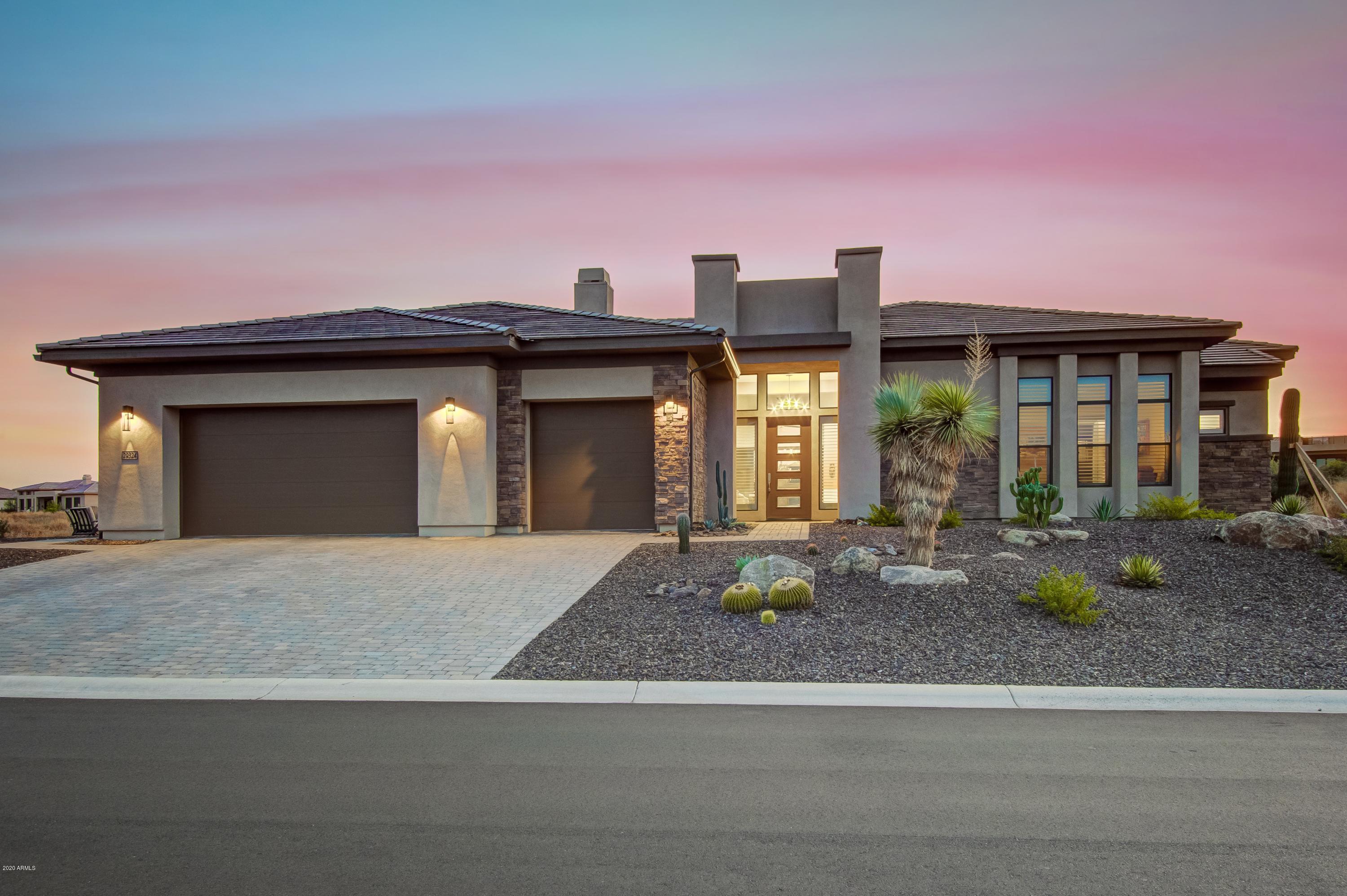 29324 North Round Butte Road Rio Verde, AZ 85263 - Photo 1 of 33 a front view of a house with porch and dining space