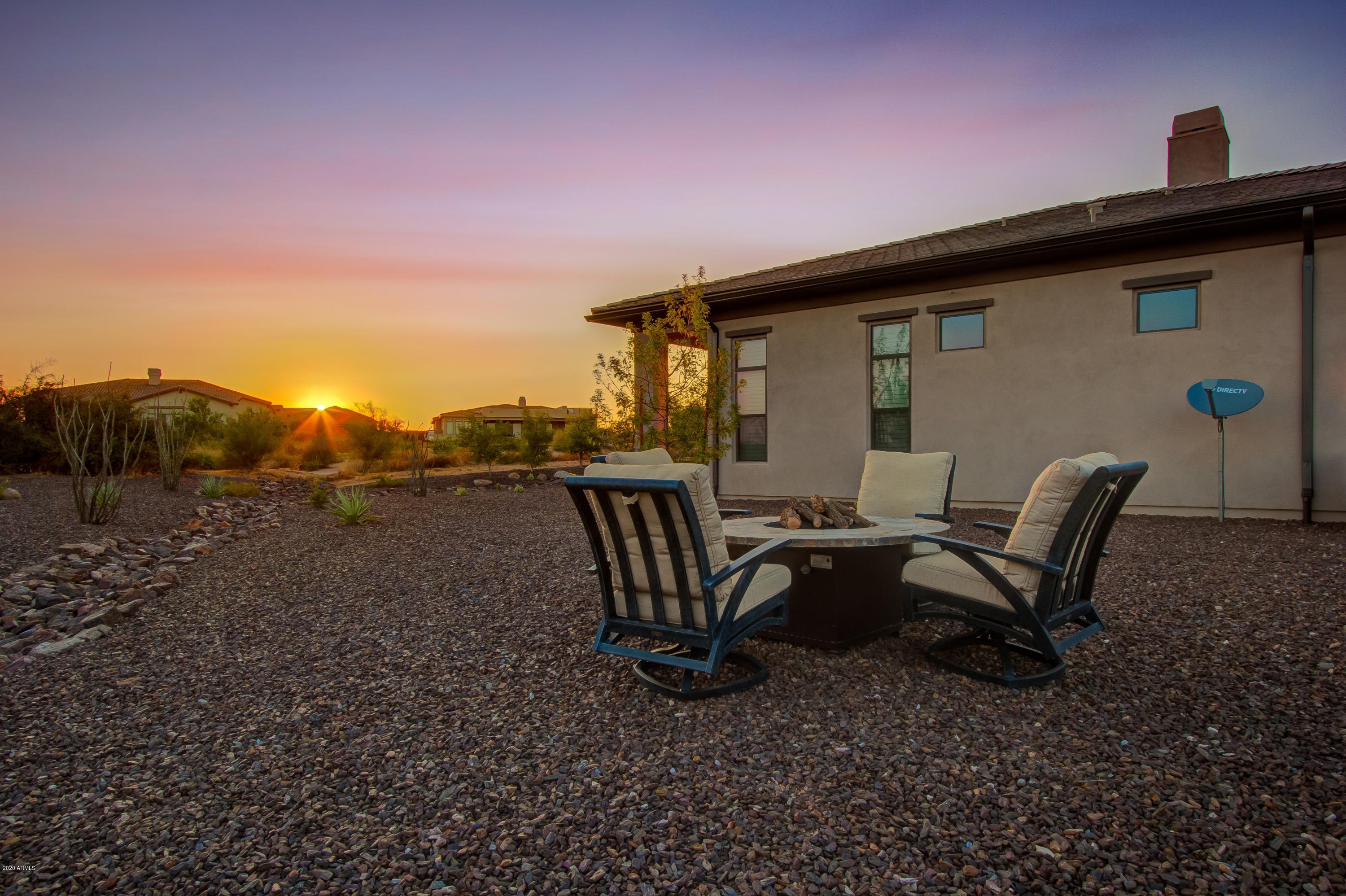 29324 North Round Butte Road Rio Verde, AZ 85263 - Photo 24 of 33 a view of backyard with seating space and trees