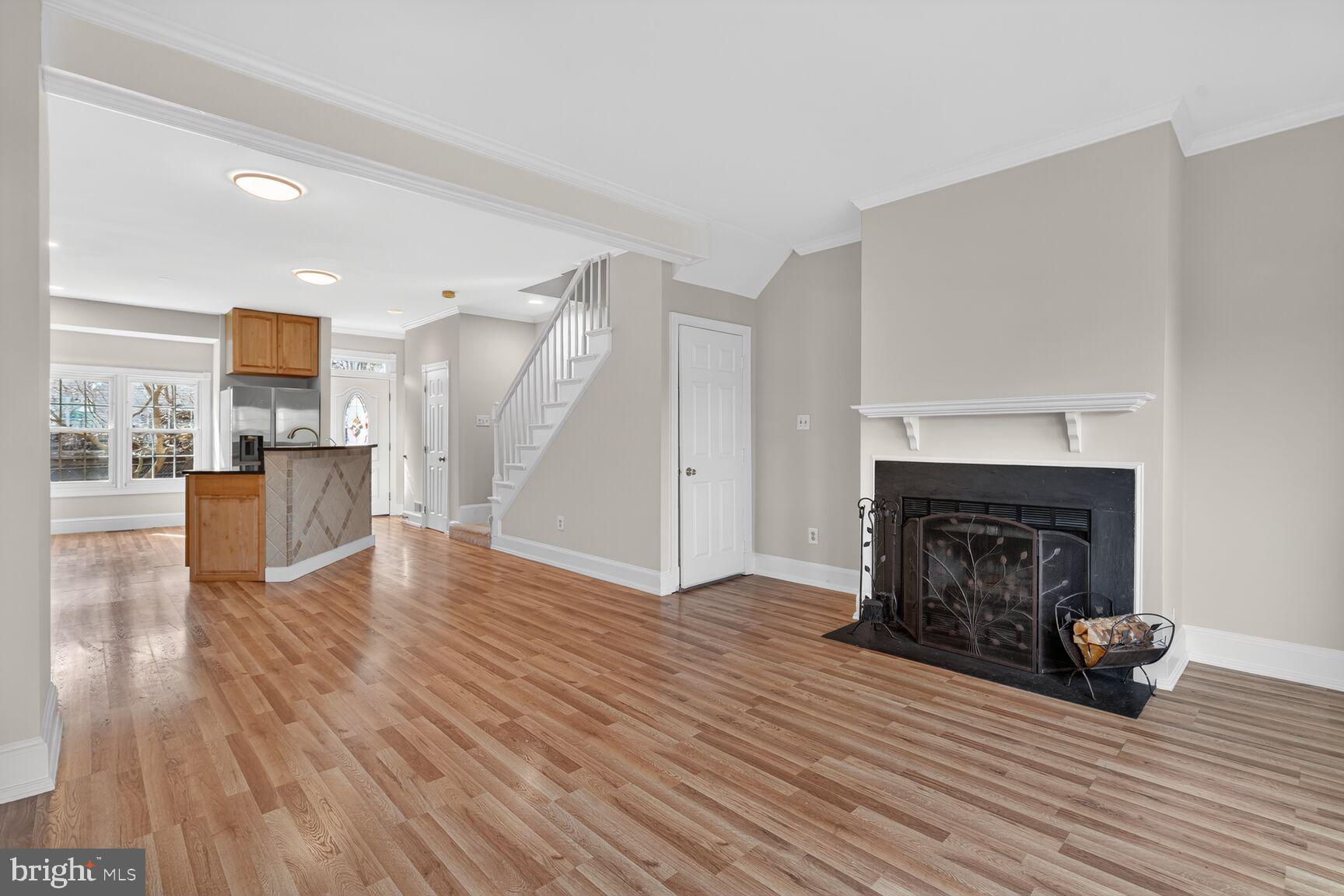 119 River Road Occoquan, VA 22125 - Photo 1 of 36 a view of a livingroom with wooden floor and a fireplace