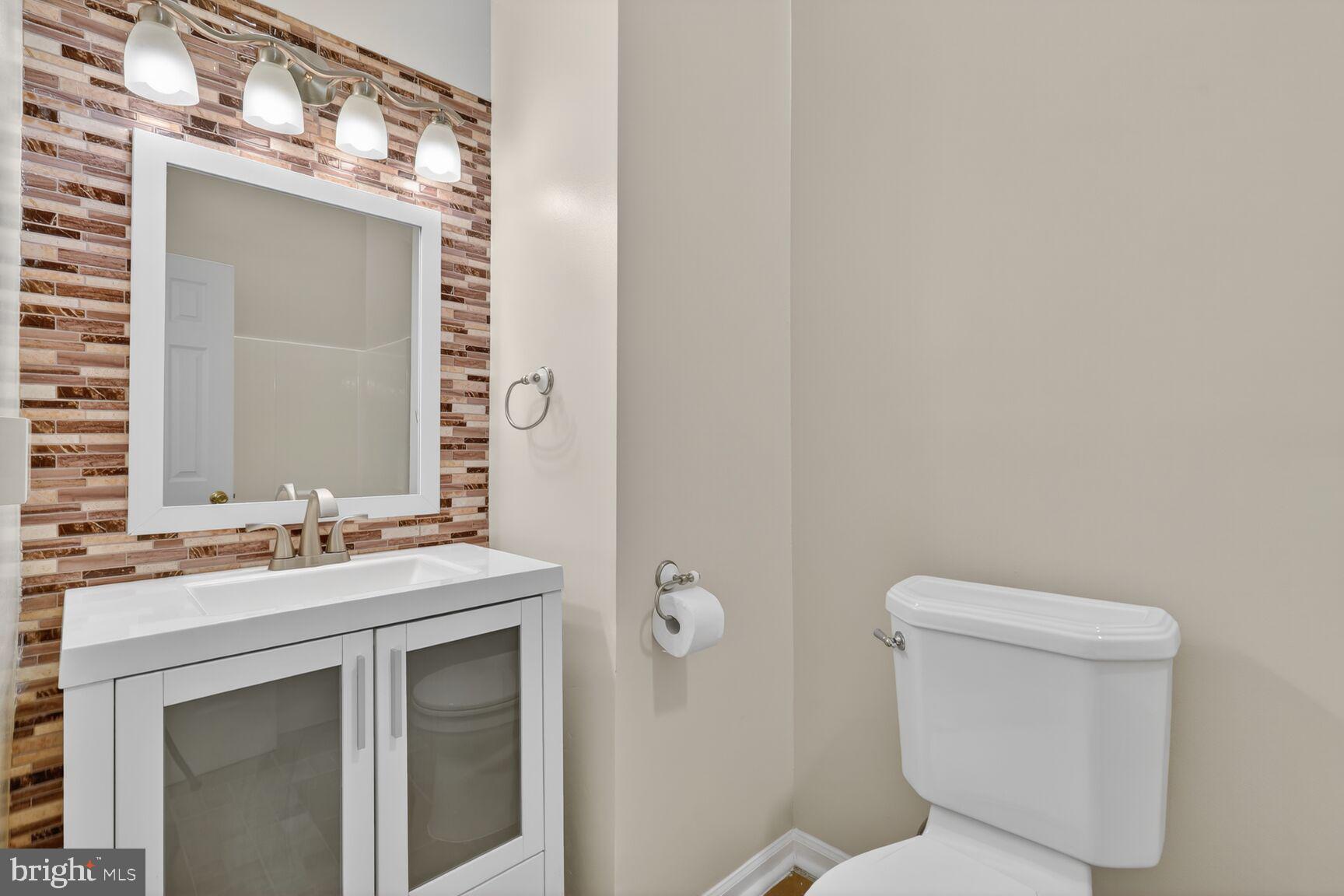 119 River Road Occoquan, VA 22125 - Photo 18 of 36 a bathroom with a sink vanity mirror and toilet