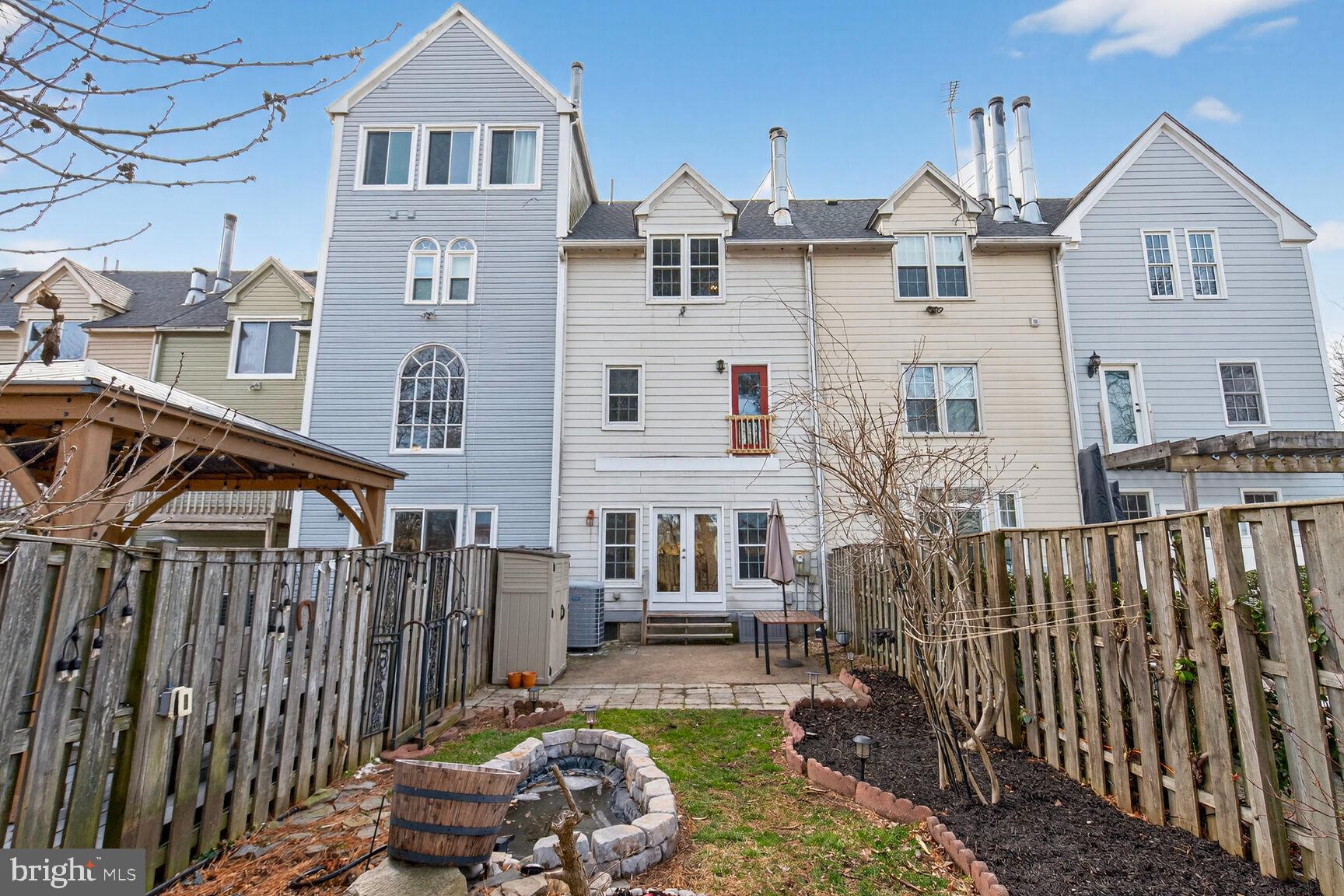119 River Road Occoquan, VA 22125 - Photo 27 of 36 a front view of a house with a garden