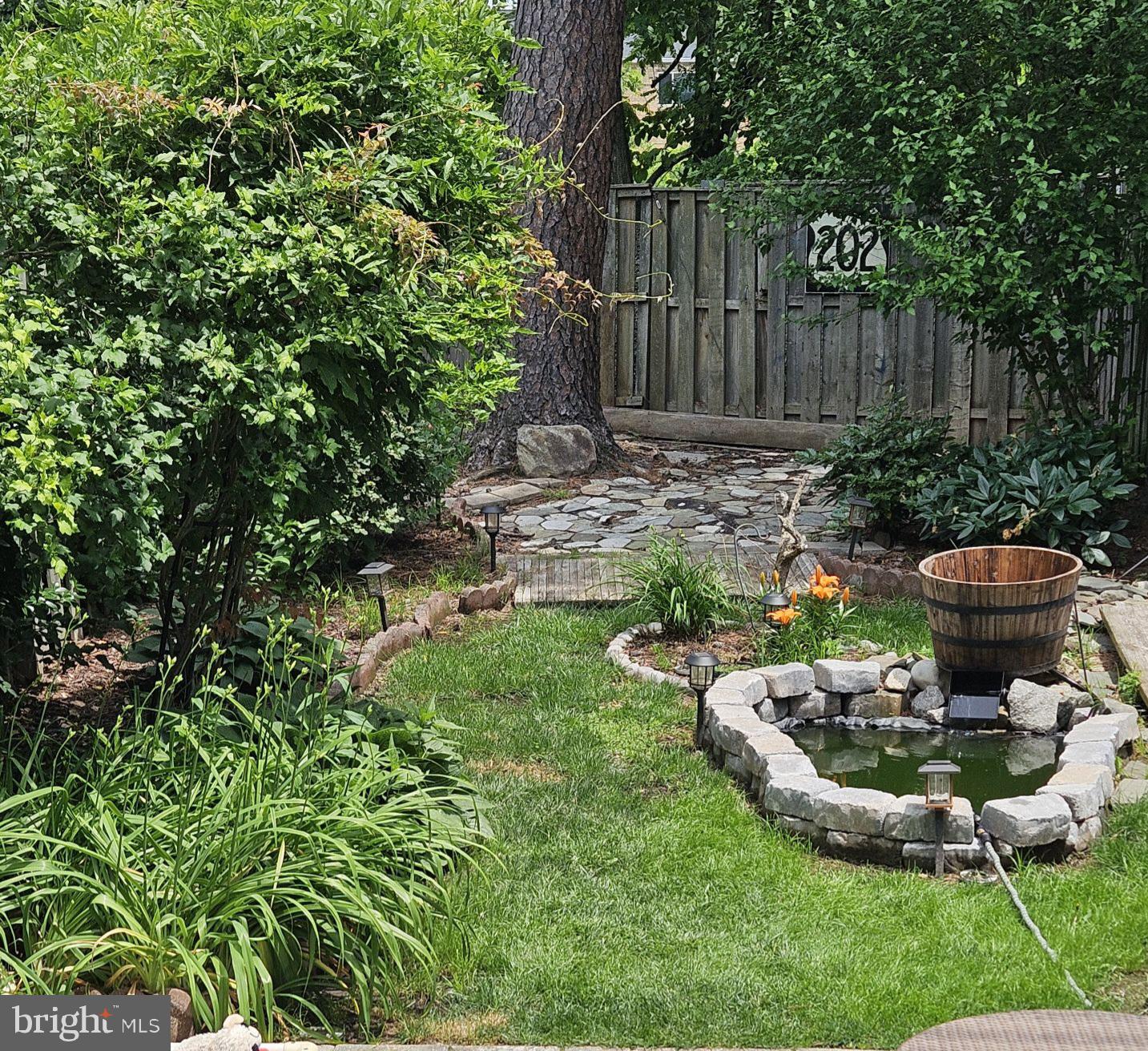 119 River Road Occoquan, VA 22125 - Photo 29 of 36 a view of a chair and table in backyard