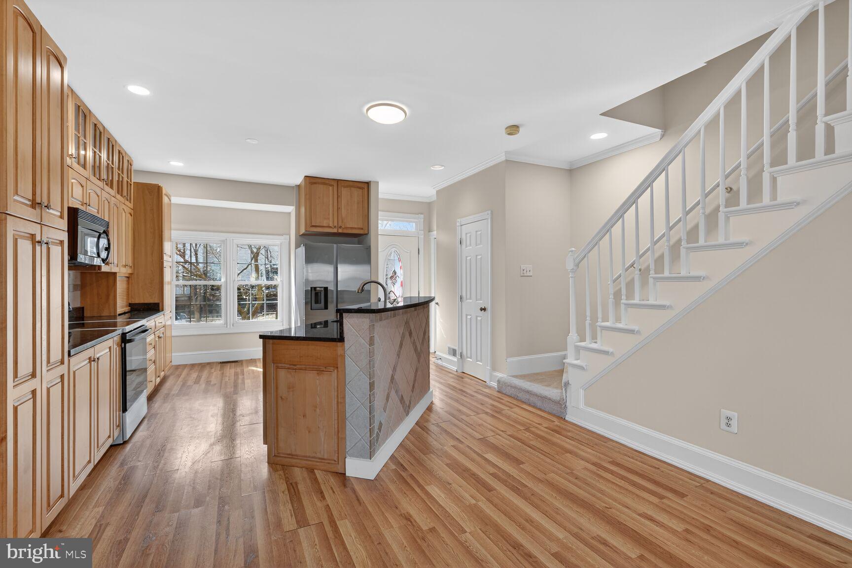 119 River Road Occoquan, VA 22125 - Photo 3 of 36 a view of a kitchen with wooden floor and electronic appliances