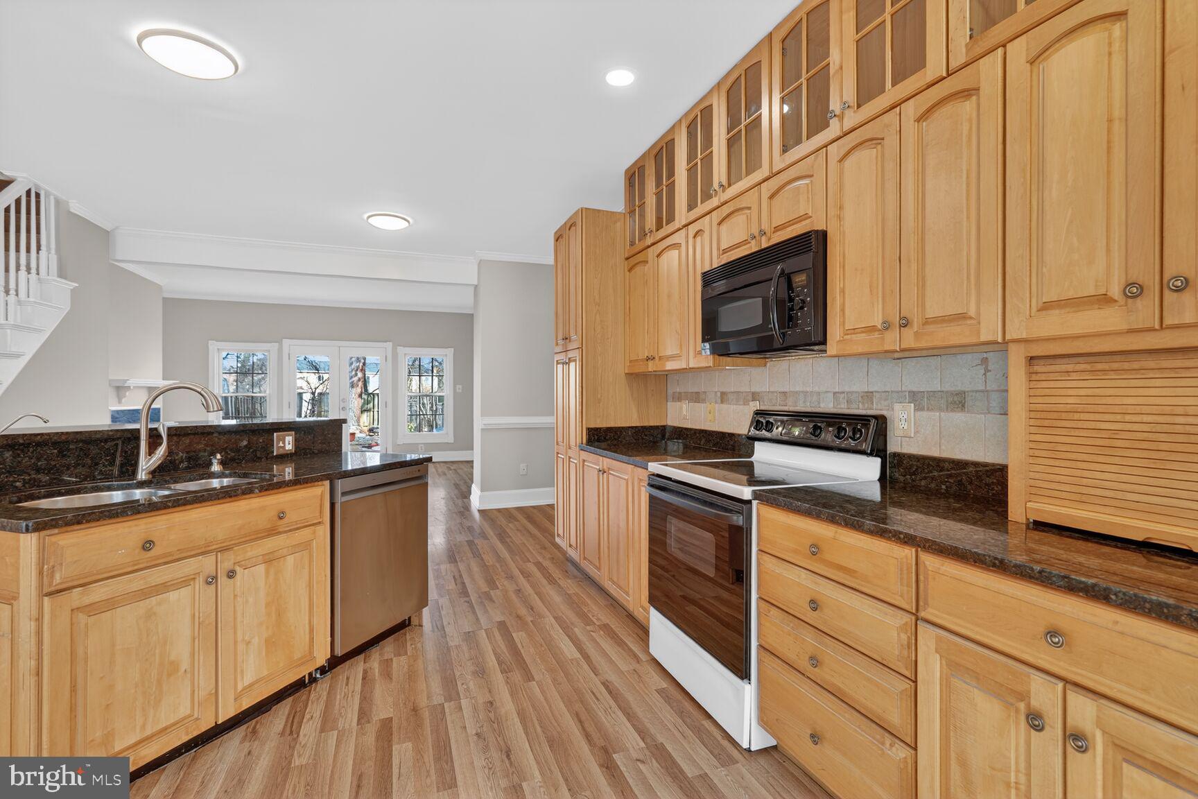 119 River Road Occoquan, VA 22125 - Photo 5 of 36 a kitchen with stainless steel appliances granite countertop a stove a sink and a microwave