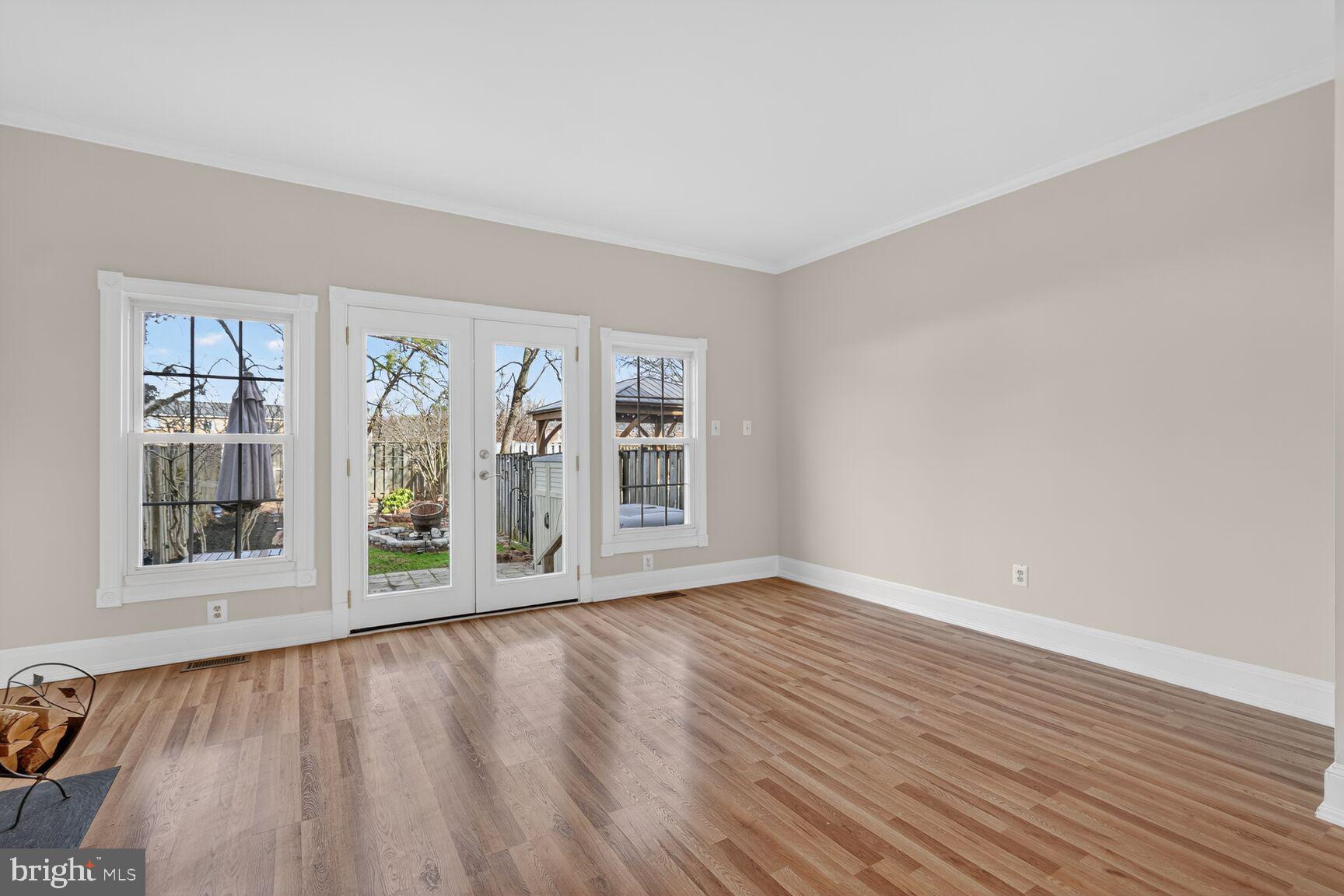 119 River Road Occoquan, VA 22125 - Photo 6 of 36 a view of an empty room with wooden floor and a window