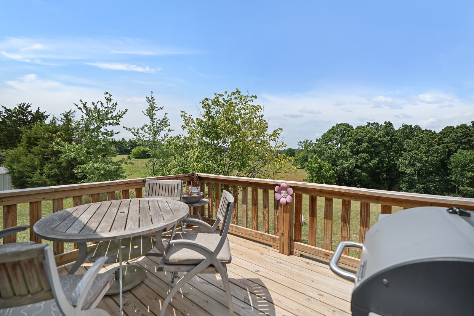 1225 Oak Grove Road Dickson, TN 37055 - Photo 13 of 14 a view of a chair and table on the roof deck