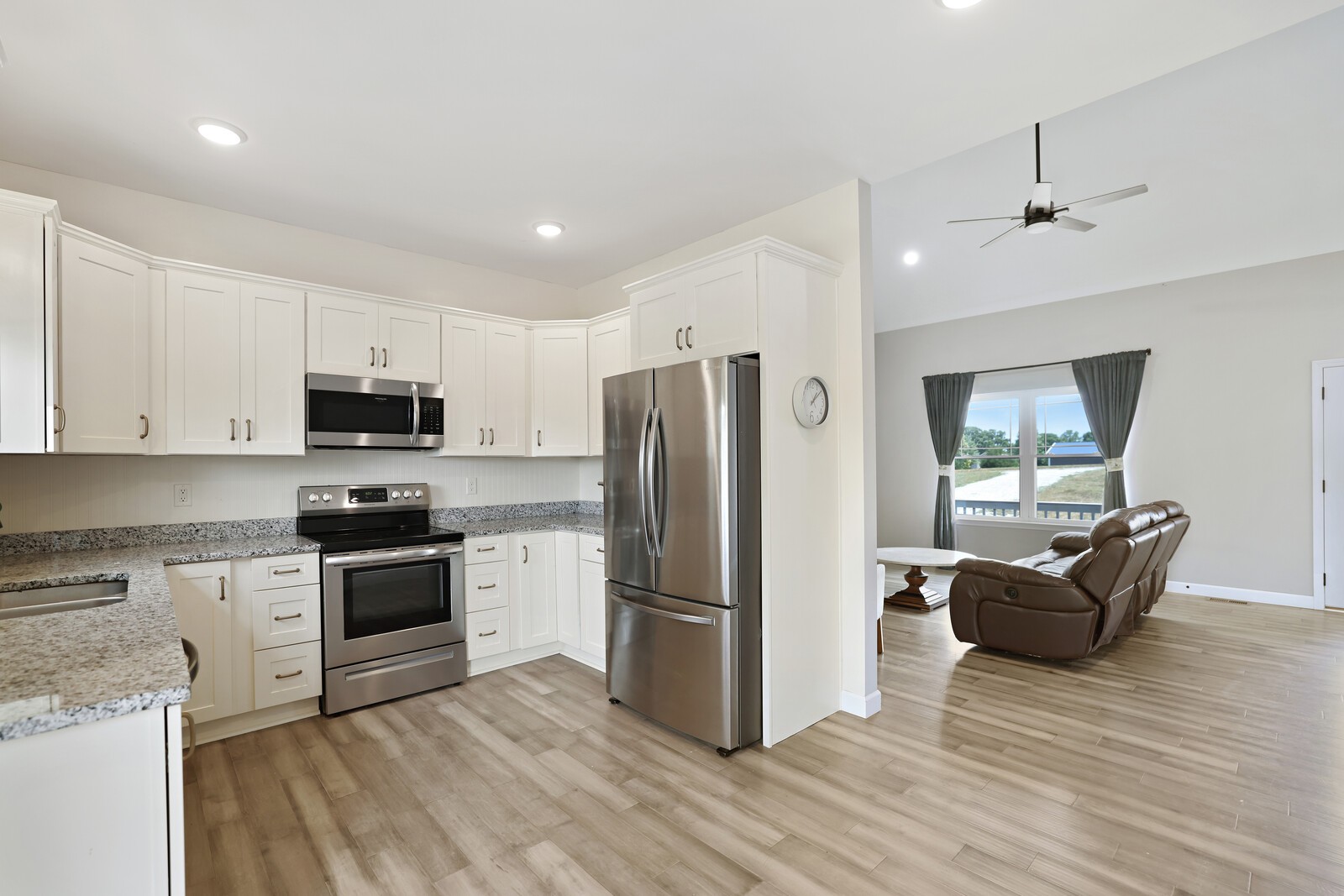 1225 Oak Grove Road Dickson, TN 37055 - Photo 5 of 14 a kitchen with granite countertop a refrigerator stove top oven and sink