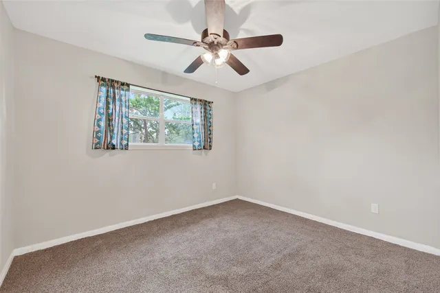 a bathroom with a sink toilet and a mirror