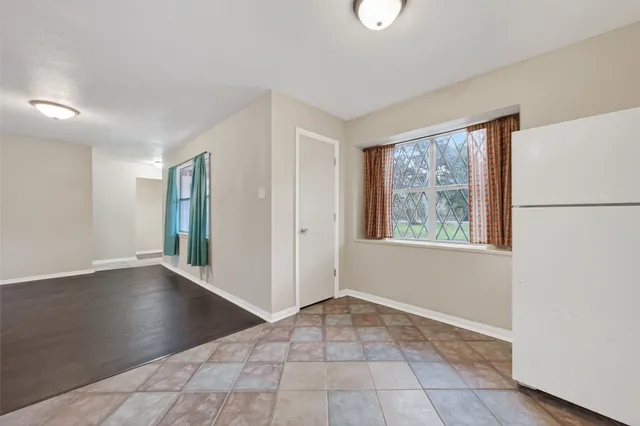 a large bathroom with a double vanity sink a mirror and a bathtub