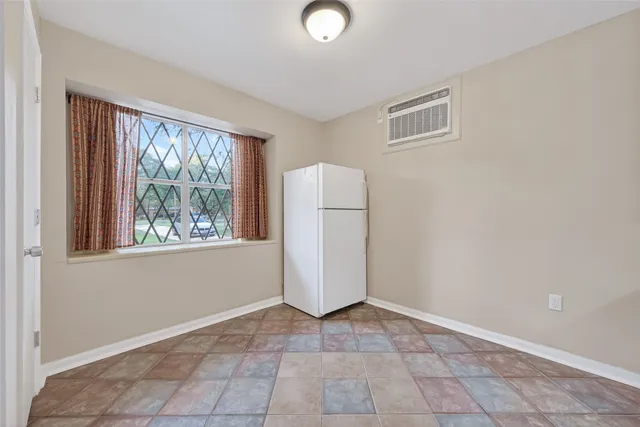 a kitchen with stainless steel appliances a sink stove and cabinets
