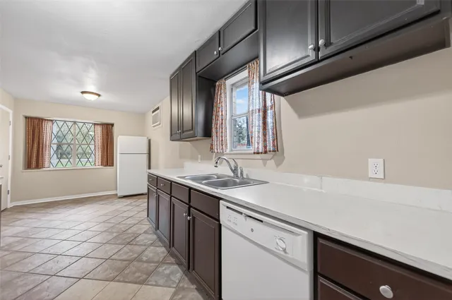 a kitchen with a sink and cabinets