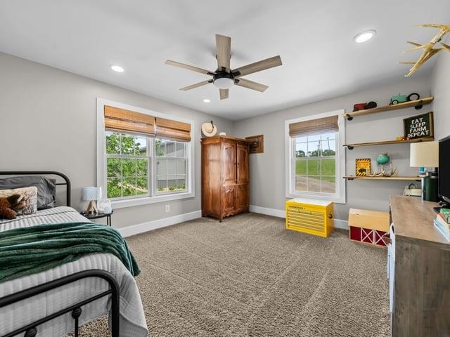 8294 North Leaf River Road Leaf River, IL 61047 - Photo 27 of 56 a spacious bedroom with a bed and a large window