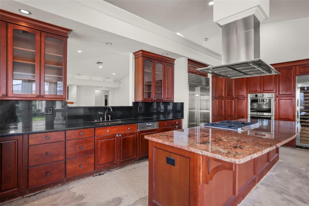 1721 Gulf Road Tarpon Springs, FL 34689 - Photo 13 of 96 a kitchen with stainless steel appliances granite countertop a sink and a stove