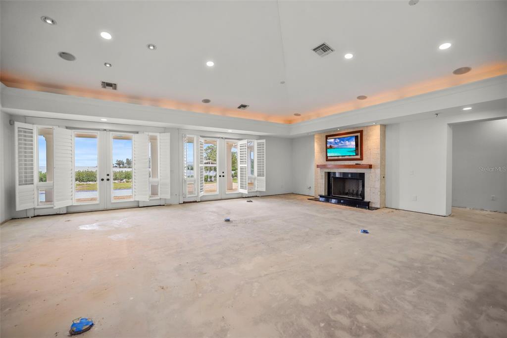 1721 Gulf Road Tarpon Springs, FL 34689 - Photo 16 of 96 a view of an empty room with a fireplace and a window