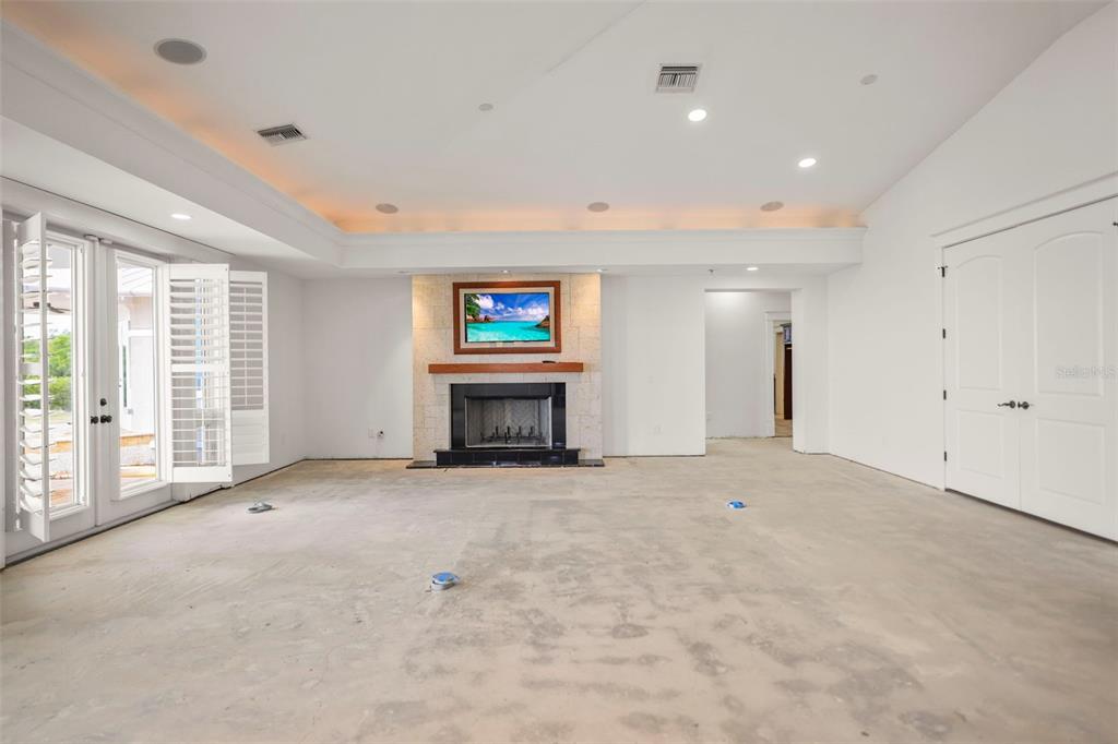 1721 Gulf Road Tarpon Springs, FL 34689 - Photo 18 of 96 a view of an empty room with a fireplace and a window