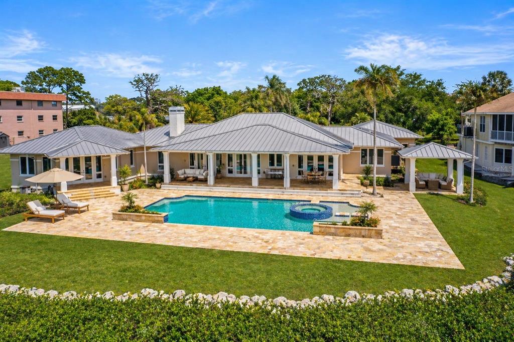 1721 Gulf Road Tarpon Springs, FL 34689 - Photo 2 of 96 a view of a house with swimming pool and sitting area