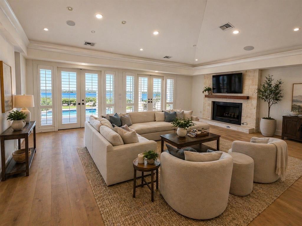 1721 Gulf Road Tarpon Springs, FL 34689 - Photo 22 of 96 a living room with furniture fireplace and flat screen tv
