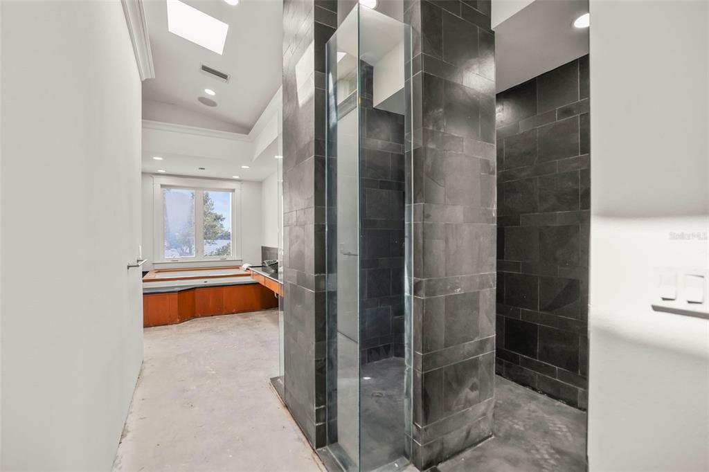 1721 Gulf Road Tarpon Springs, FL 34689 - Photo 31 of 96 a bathroom with a tub and shower