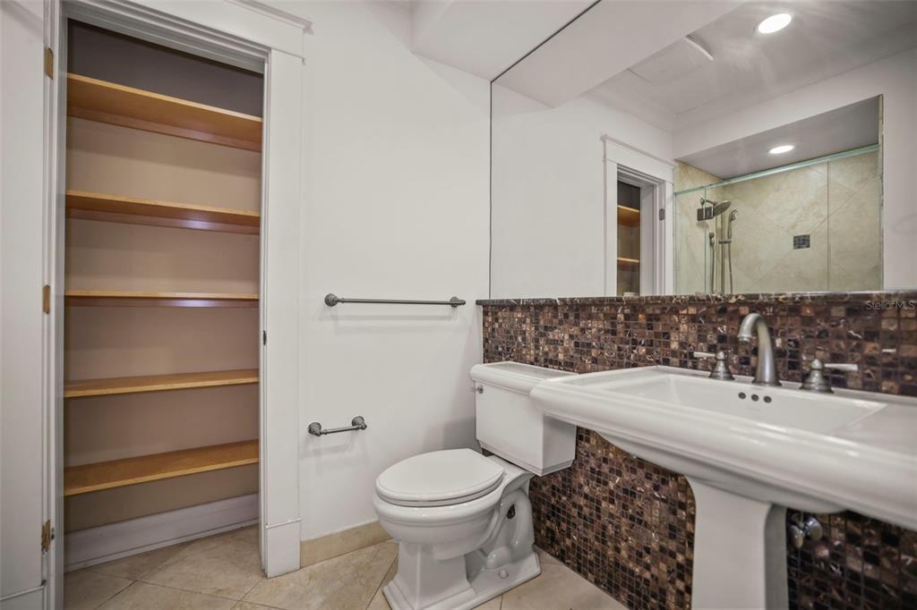 1721 Gulf Road Tarpon Springs, FL 34689 - Photo 35 of 96 a bathroom with a sink toilet and mirror