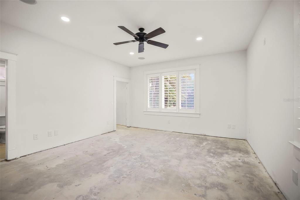 1721 Gulf Road Tarpon Springs, FL 34689 - Photo 36 of 96 an empty room with windows and fan