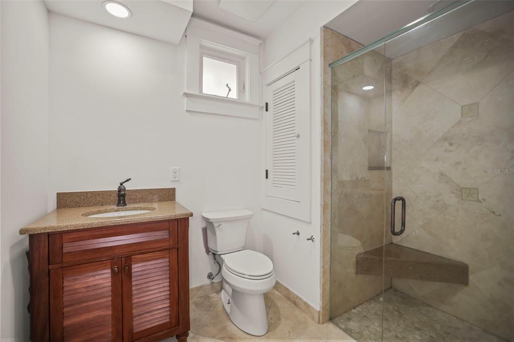 1721 Gulf Road Tarpon Springs, FL 34689 - Photo 38 of 96 a bathroom with a toilet a sink and shower