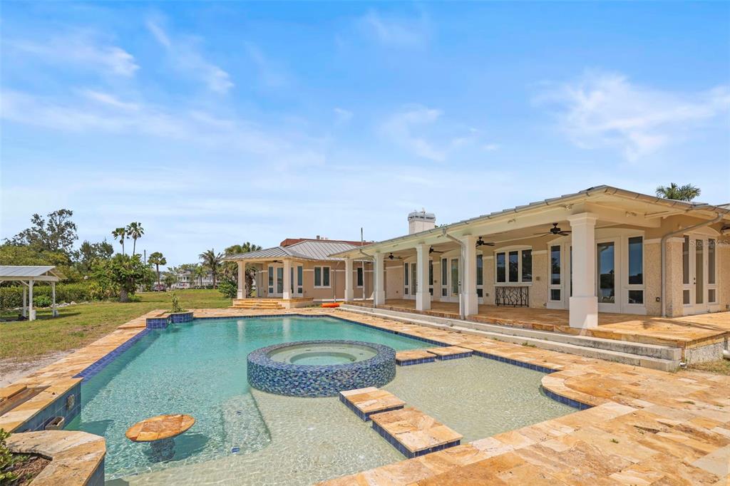 1721 Gulf Road Tarpon Springs, FL 34689 - Photo 55 of 96 a front view of a house with swimming pool having outdoor seating