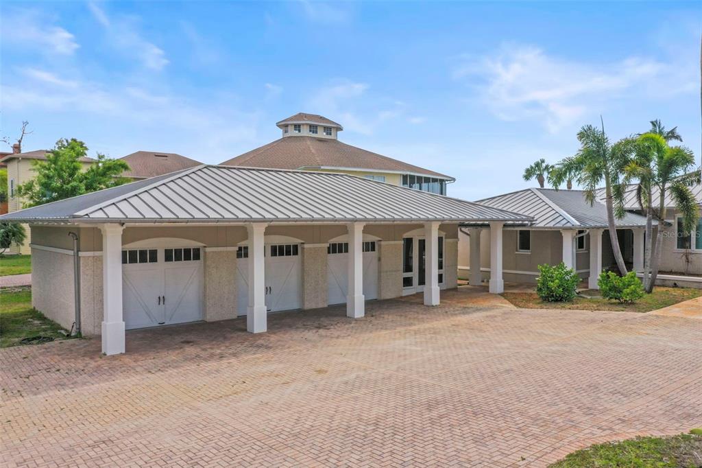 1721 Gulf Road Tarpon Springs, FL 34689 - Photo 61 of 96 a front view of a house with a garden