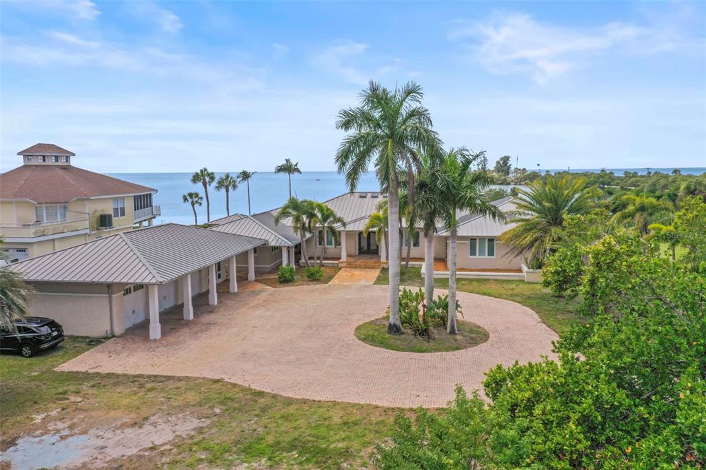 1721 Gulf Road Tarpon Springs, FL 34689 - Photo 7 of 96 a view of a house with swimming pool and sitting area