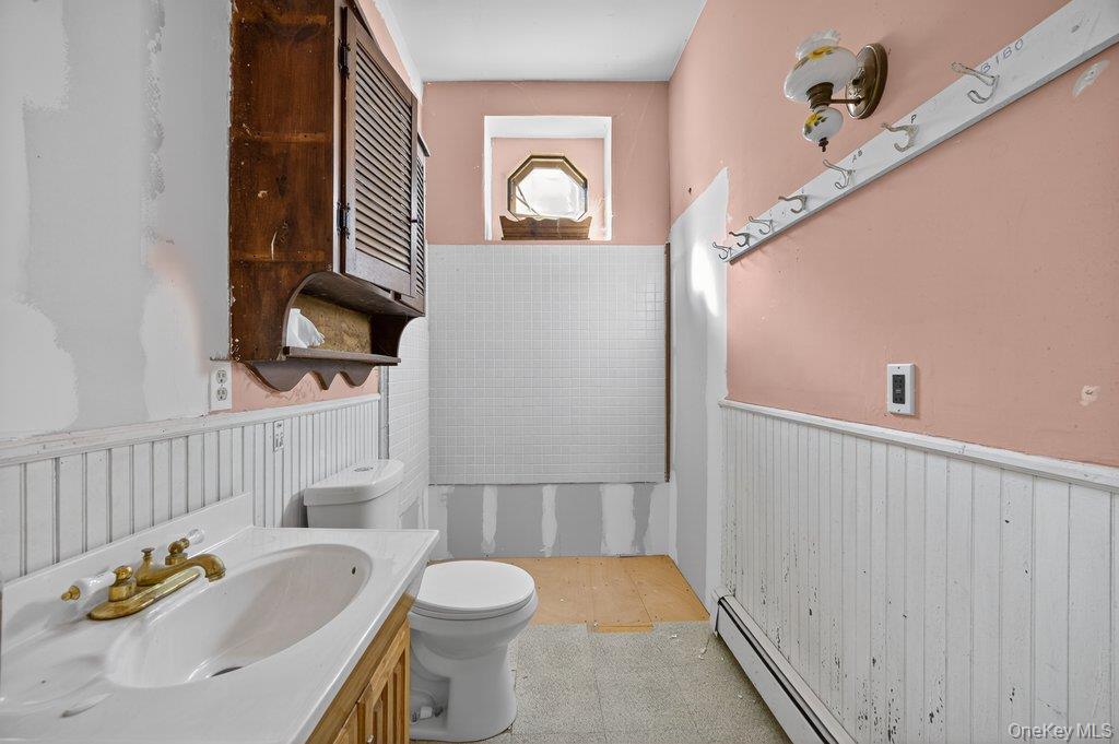 37 Little Road Wurtsboro, NY 12790 - Photo 12 of 24 a bathroom with a sink toilet and mirror