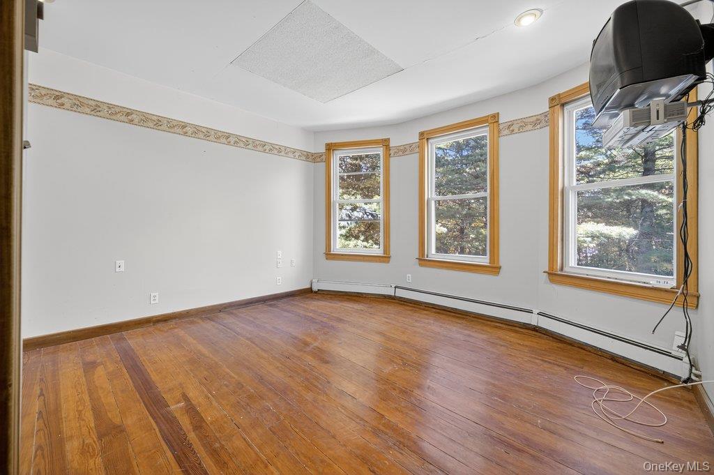 37 Little Road Wurtsboro, NY 12790 - Photo 13 of 24 a view of an empty room with window and wooden floor