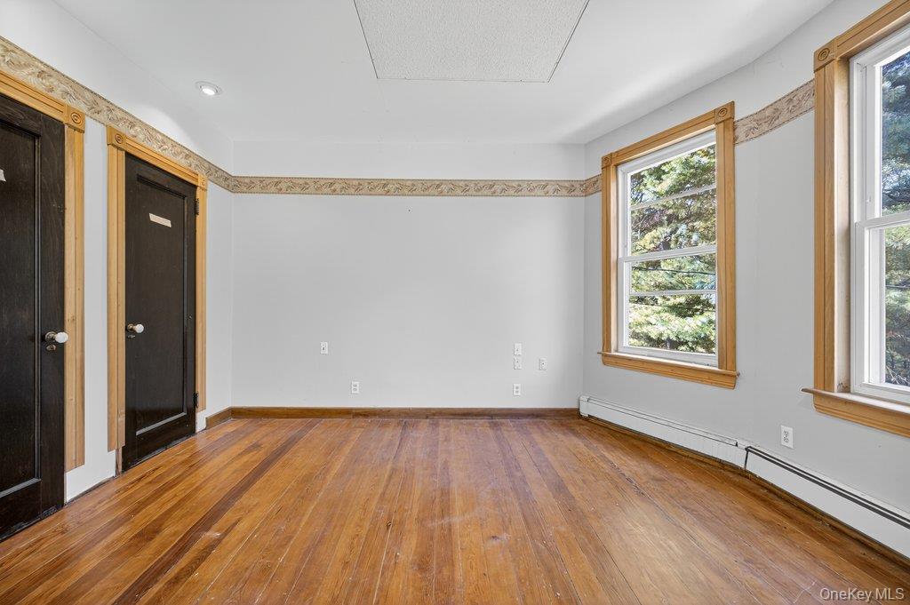 37 Little Road Wurtsboro, NY 12790 - Photo 14 of 24 a view of an empty room with wooden floor and a window