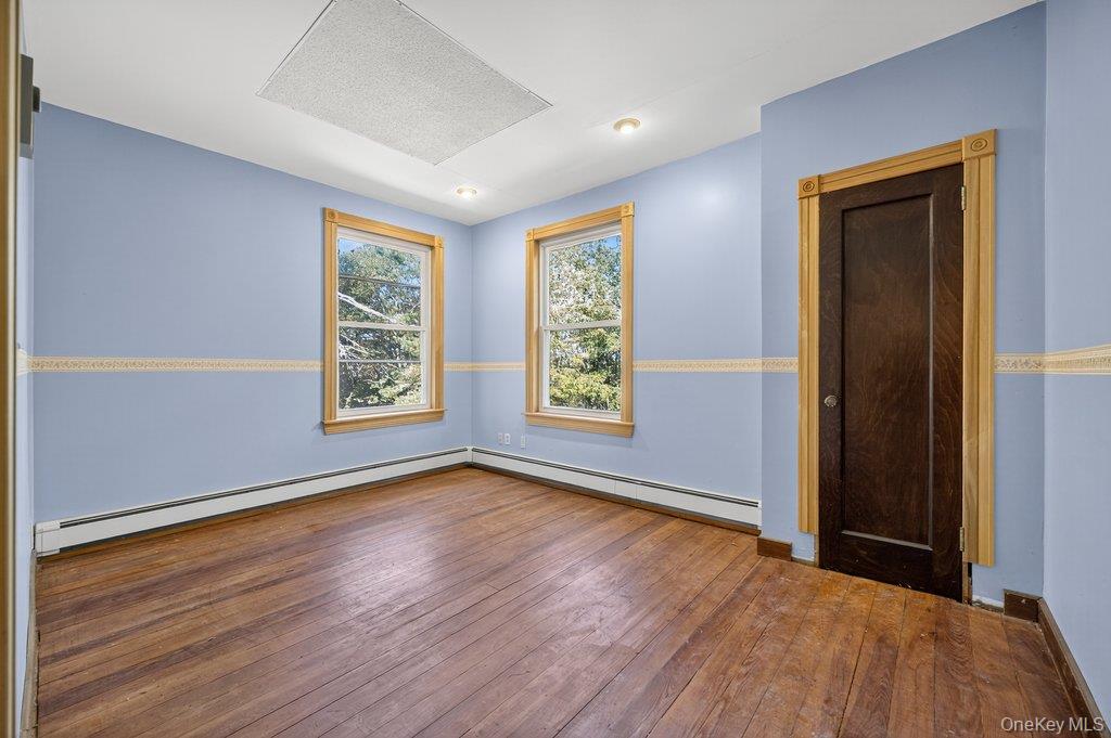37 Little Road Wurtsboro, NY 12790 - Photo 18 of 24 a view of an empty room with wooden floor and a window