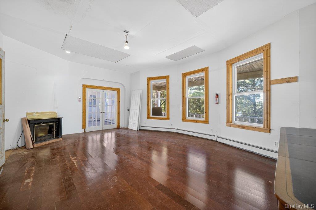 37 Little Road Wurtsboro, NY 12790 - Photo 4 of 24 a view of an empty room with a window and wooden floor
