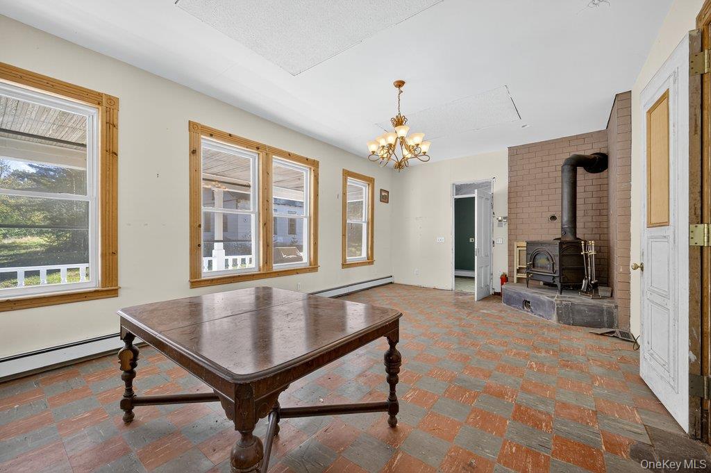 37 Little Road Wurtsboro, NY 12790 - Photo 5 of 24 a living room with table chairs and a table
